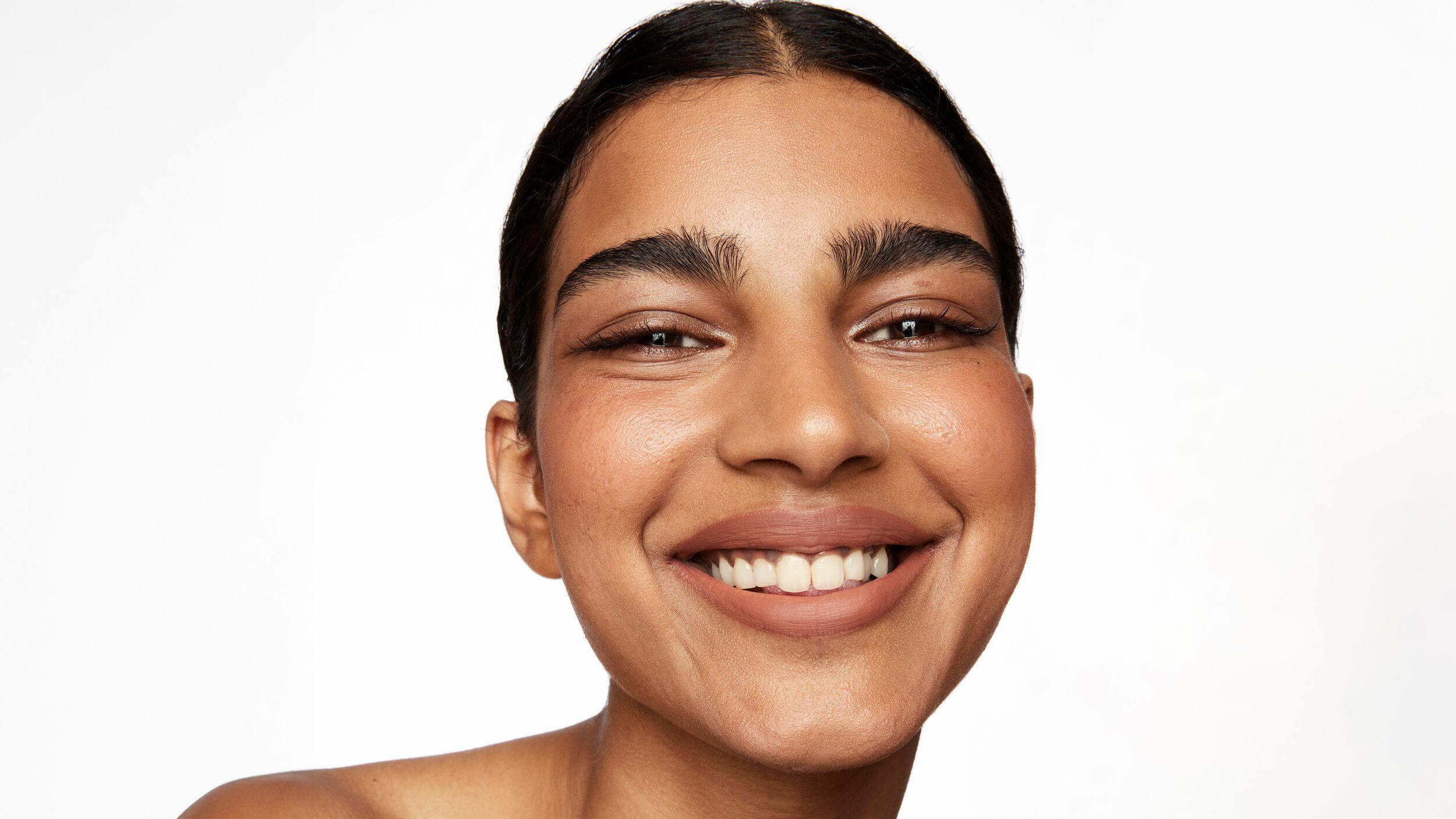 young-skincare-2.jpg Young girl smiling at the camera