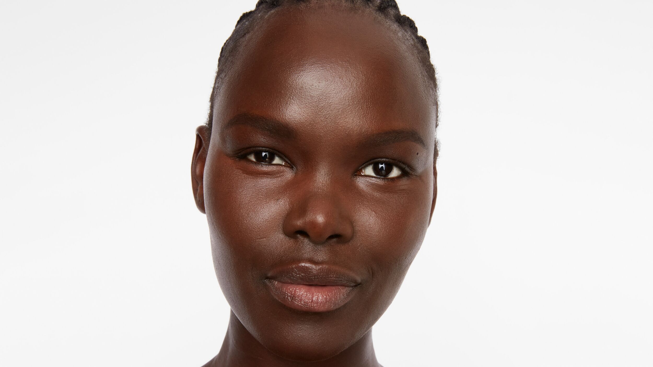 ginseng_blog.jpg Woman staring directly into the camera with glowing skin
