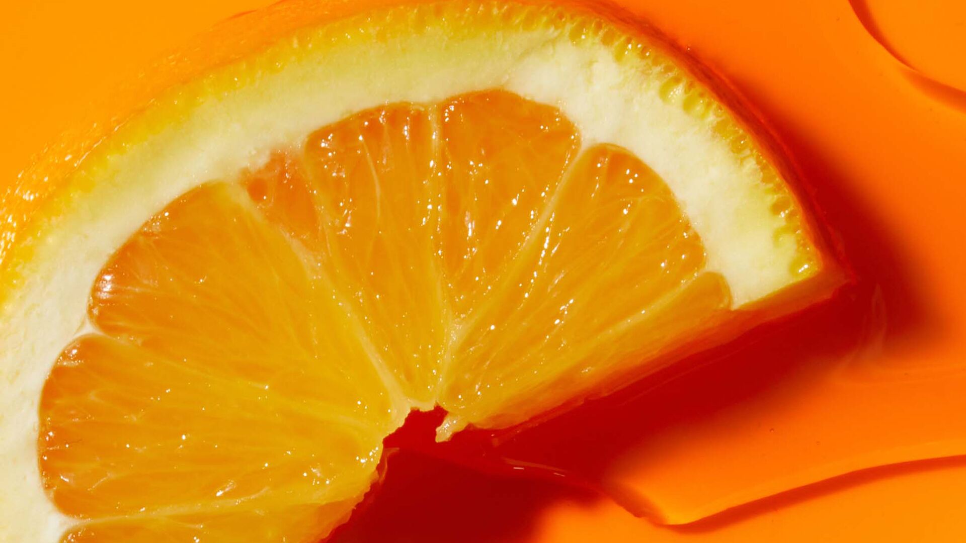 vitamin-c-image.jpg Close up of an orange and Vitamin C skincare