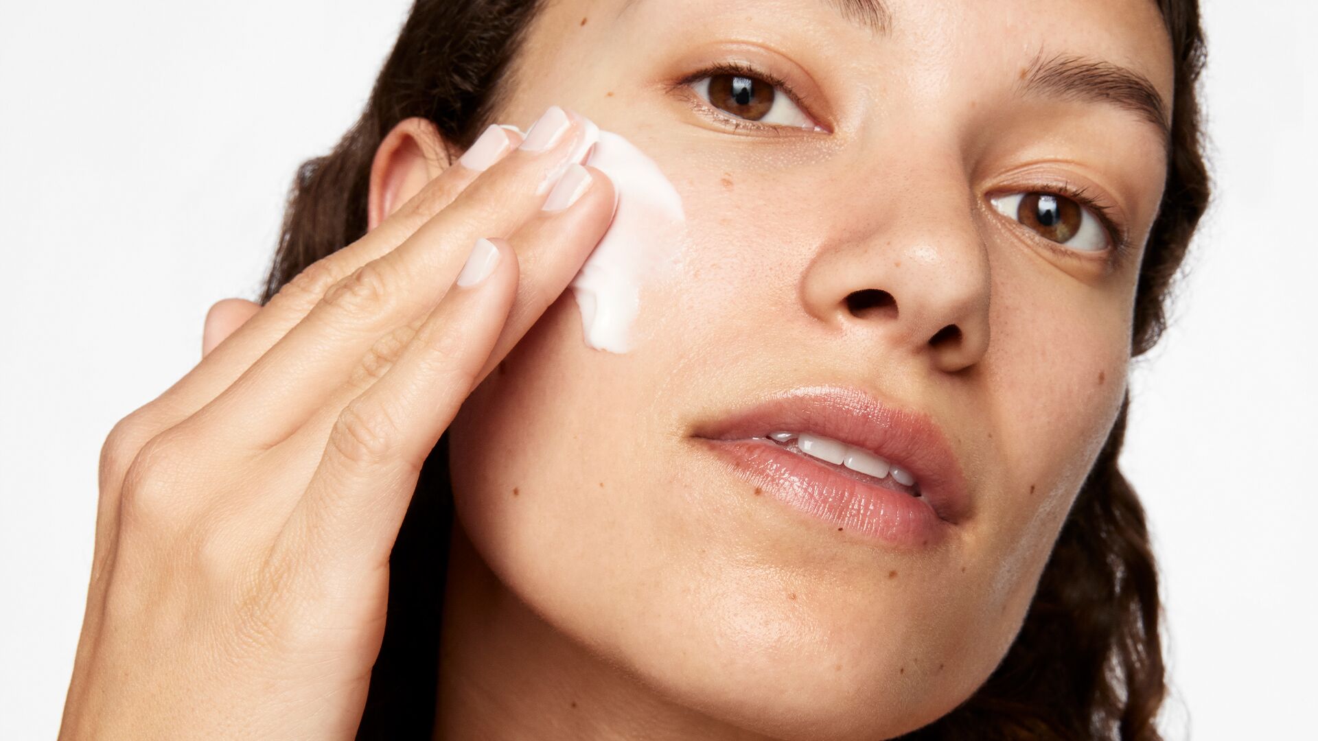 model-applying-cream.jpg Model applying cream
