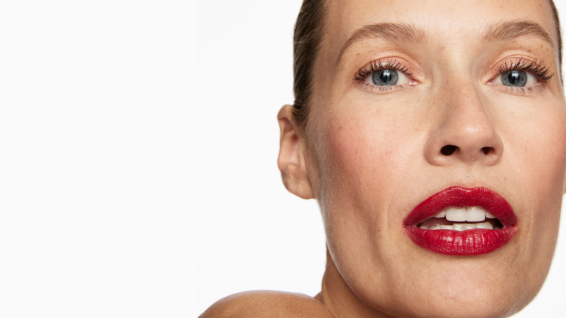 red-lip-makeup.jpg Close up of a woman with a red lip makeup look