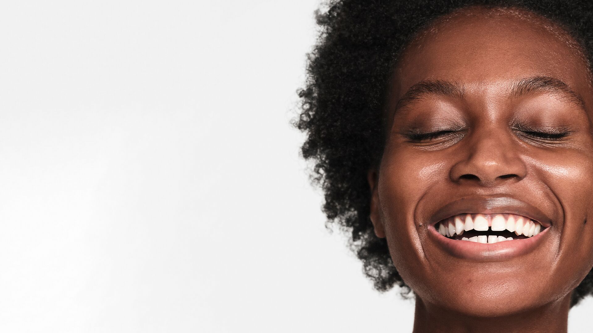 glowy-skin-body.jpg In body image of woman laughing