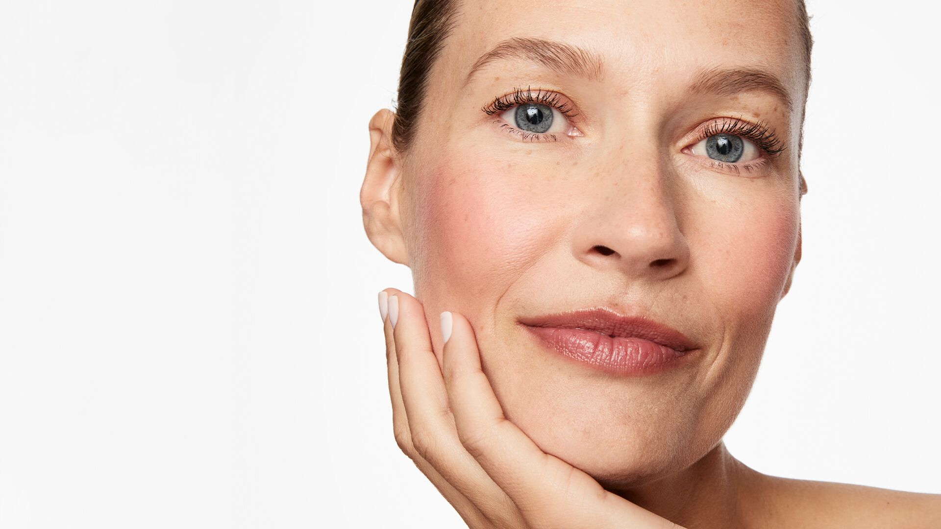 blog-inflammaging-hero.jpg Inflammaging: Model With Hand On Chin