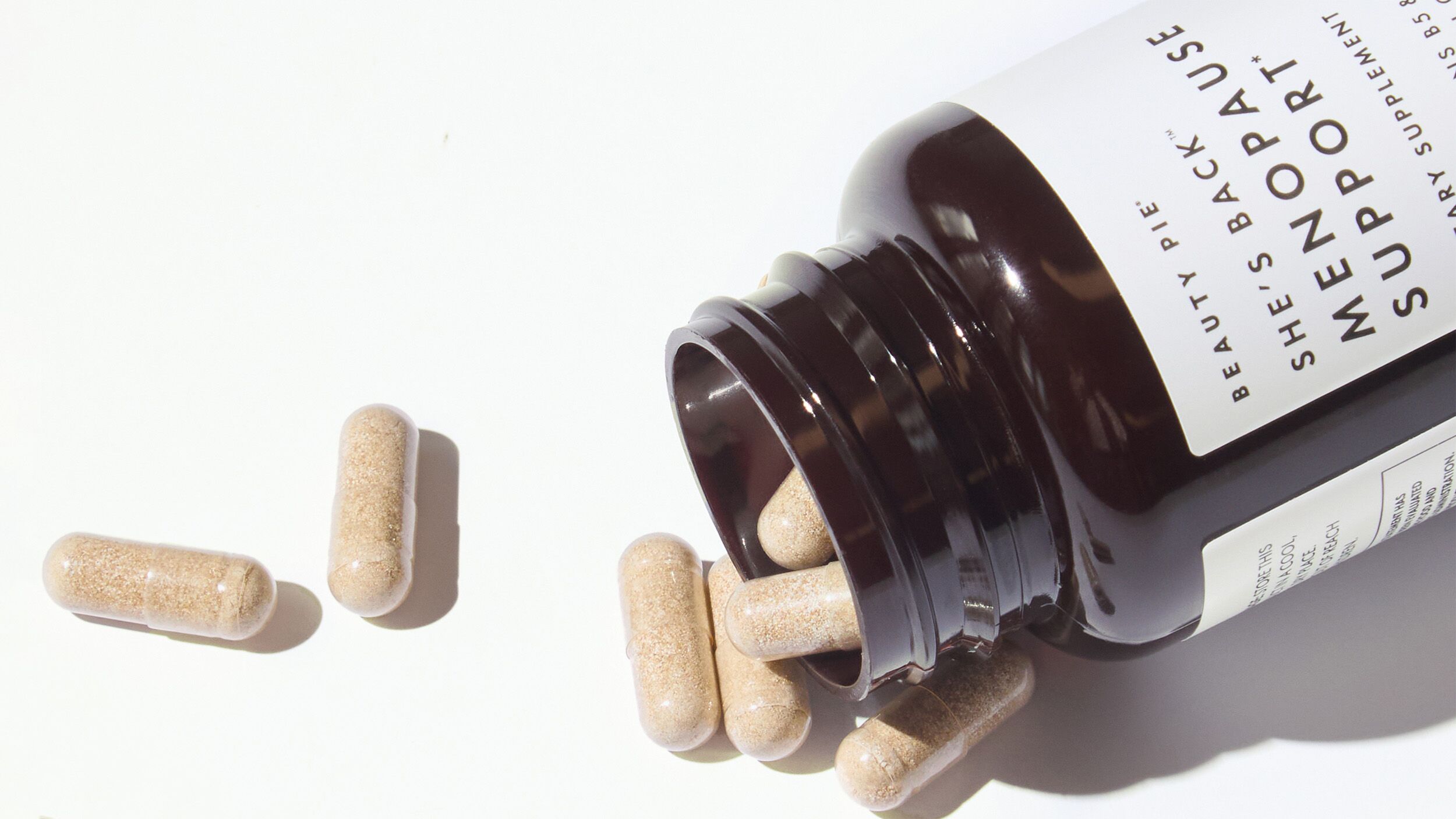 blog-menopause-support-supplement.jpg Menopause Support supplement bottle open capsules spilling out