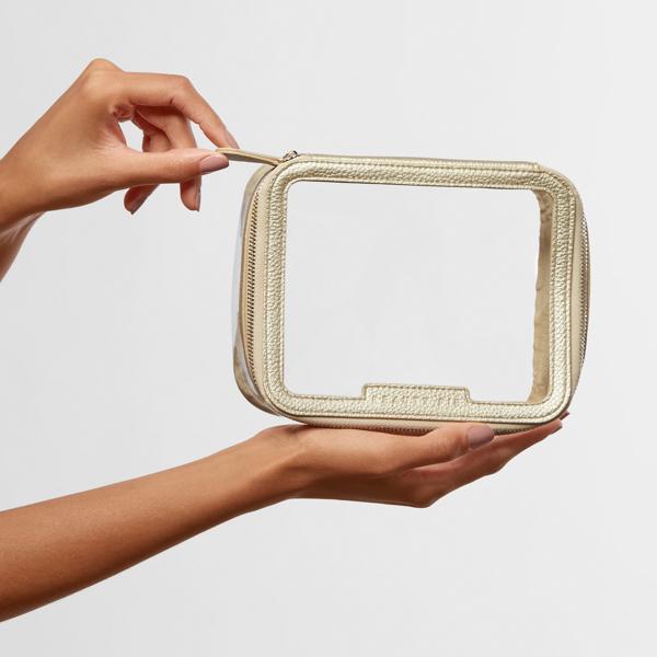 medium_gold_makeup_bag_dustbag_199562_CSL_handmodel_WEB_1
